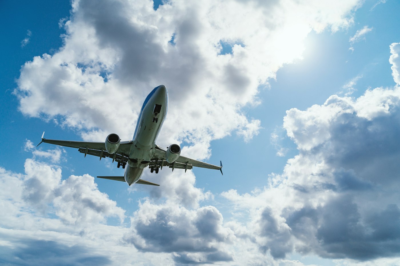 Passenger airplane climbing through a bright blue sky
