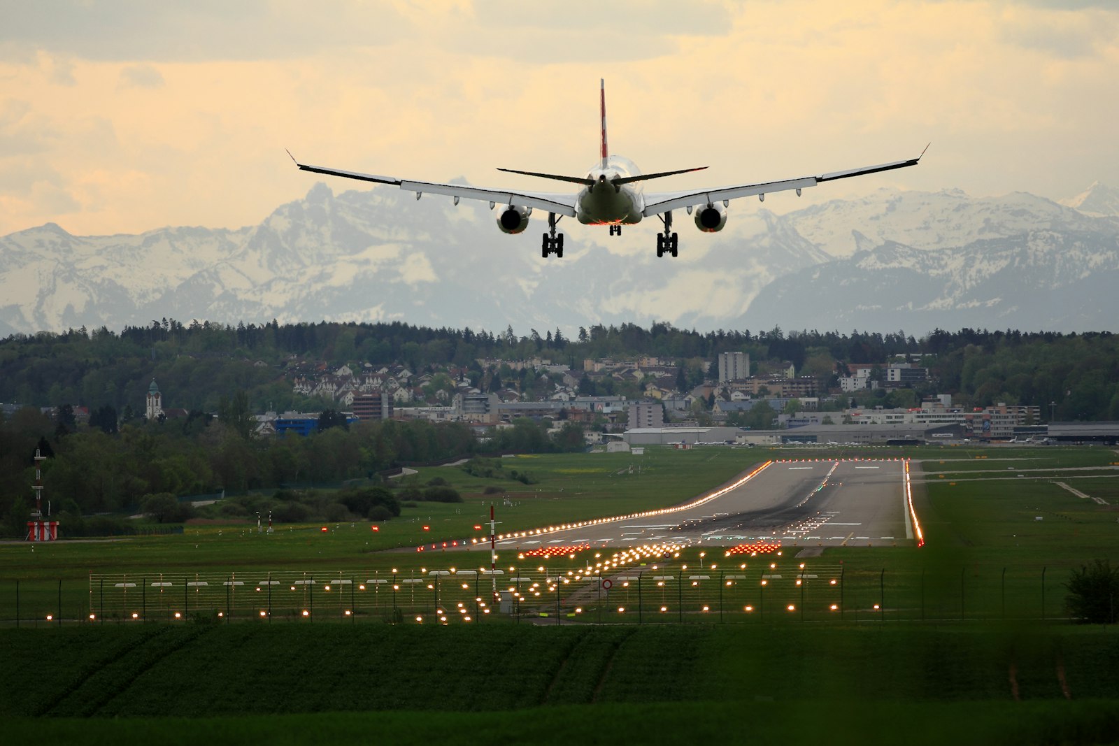 Passenger airplane on approach to land above a runway