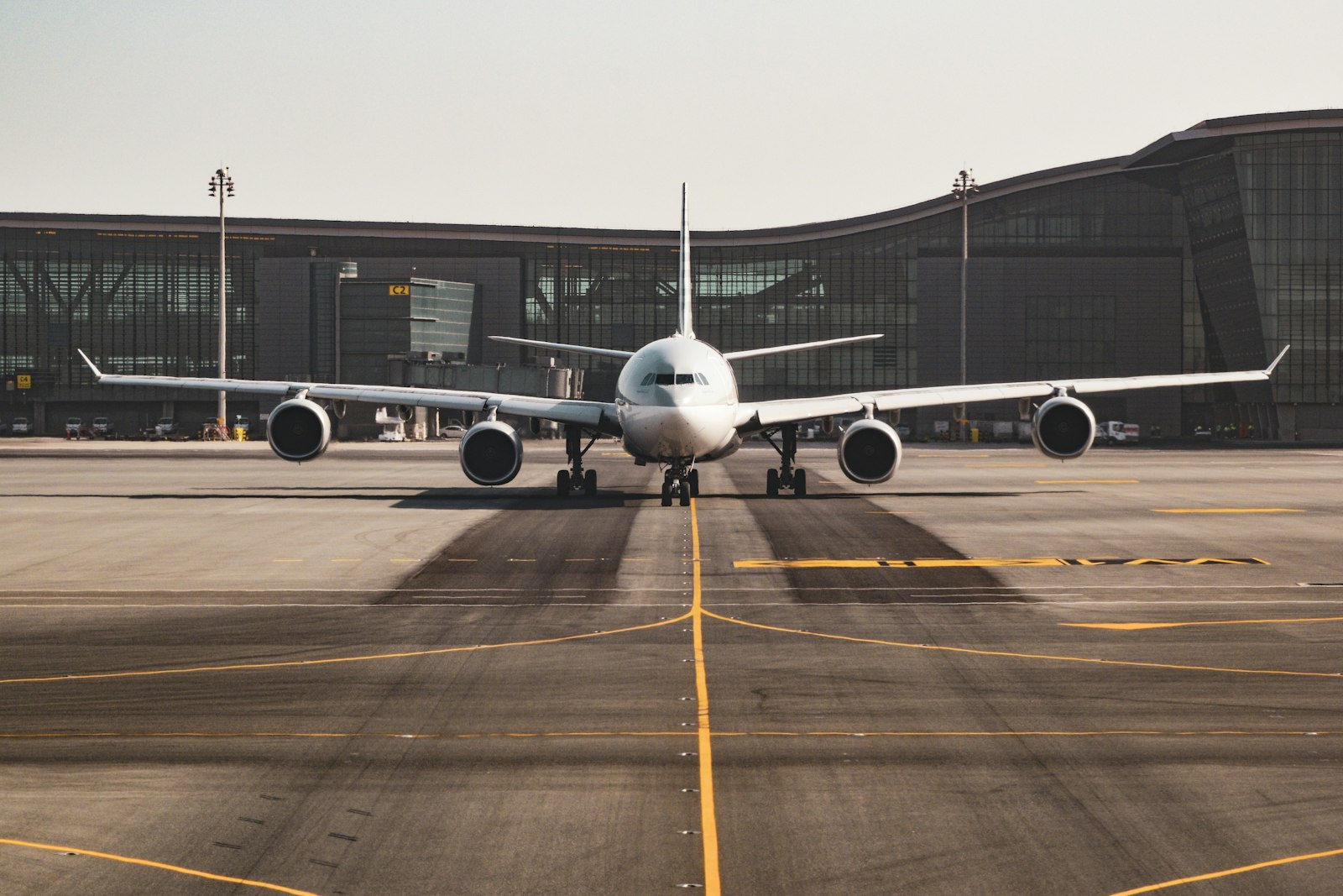 Passenger jet facing an airport terminal from the runway
